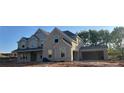 New construction featuring a two-story home with a two-car garage in a developing neighborhood at 4015 Sierra Vista Cir, Cumming, GA 30040