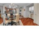 Bright dining area features modern lighting and hardwood floors at 200 River Vista Dr # 436, Atlanta, GA 30339