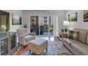 Bright living room with hardwood floors and a balcony, offering natural light and outdoor views at 200 River Vista Dr # 436, Atlanta, GA 30339