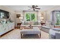 Bright living room with neutral colors, comfortable seating, and large windows providing natural light at 1518 Rochelle Dr, Atlanta, GA 30338
