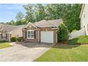 Beautiful single-story brick home with an attached garage and lush greenery enhancing its curb appeal at 171 Nacoochee Way, Canton, GA 30114
