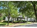 A charming house with large green trees in a Gathering-friendly neighborhood setting at 178 Mission Oak Dr, Grayson, GA 30017