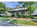 Charming two-story home with a welcoming front porch, neat landscaping and lovely curb appeal at 178 Mission Oak Dr, Grayson, GA 30017