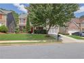 Inviting front yard view of a two-story home with manicured lawn and charming curb appeal at 3133 Bridge Walk Dr, Lawrenceville, GA 30044