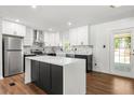 Modern kitchen with marble countertops, stainless steel appliances, and a center island at 4158 Pepperdine Dr, Decatur, GA 30034