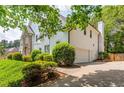 Spacious home with a two-car garage and lush landscaping, offering both convenience and aesthetic appeal at 725 Eider Down Ct, Alpharetta, GA 30022