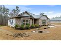 Beautiful home featuring brick accents and neat landscaping offering great curb appeal at 8268 E Carroll Rd, Whitesburg, GA 30185