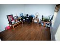 Spacious home office with hardwood floors, neutral walls, and ample natural light at 4041 Smithfield Trl, Ellenwood, GA 30294