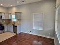 Bright kitchen with stainless steel appliances, granite countertops, and tile flooring at 490 Rockwell Sw St, Atlanta, GA 30310