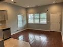 Bright living room featuring hardwood floors, neutral paint, and multiple windows for natural light at 490 Rockwell Sw St, Atlanta, GA 30310