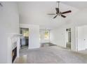 Bright living room with a fireplace, ceiling fan and neutral walls at 332 Christian Ln, Carrollton, GA 30116