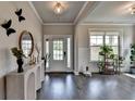 Bright foyer featuring wood floors, neutral walls, modern decor, and great natural light at 3985 Foxdale Ln, Cumming, GA 30028
