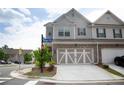 Beautiful home exterior with a two-car garage and a manicured front yard at 532 Walton Dr, Woodstock, GA 30188