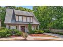 Charming two-story home features a well-manicured lawn and inviting front porch at 3800 Market Walk, Clarkston, GA 30021