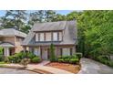 Charming two-story home features a well-manicured lawn and inviting front porch at 3800 Market Walk, Clarkston, GA 30021