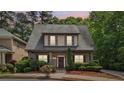Charming two-story home features a well-manicured lawn and inviting front porch at 3800 Market Walk, Clarkston, GA 30021