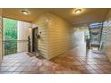 Hallway featuring tile floors and entry to unit and stairs to upper level at 3777 Peachtree Ne Rd # 1512, Brookhaven, GA 30319