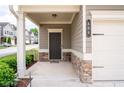 Inviting front entrance with stone accents and a covered porch area at 406 Crescent Woode Dr, Dallas, GA 30157
