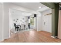 Bright dining room features hardwood floors, contemporary lighting, and a decorative wall piece at 732 Hedwig Dr, Mcdonough, GA 30252
