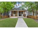 Charming home boasts a welcoming porch, manicured lawn, and craftsman details at 293 Ormond Se St, Atlanta, GA 30315