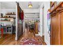 Inviting foyer with hardwood floors, stylish sliding barn door and eye-catching decor at 2109 Rugby Ave, Atlanta, GA 30337
