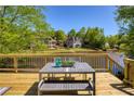 Lakeside deck perfect for outdoor relaxation with scenic views of the water at 6185 Deerwoods Trl, Alpharetta, GA 30005