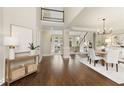 Spacious foyer with hardwood floors, elegant staircase, and ample natural light at 6185 Deerwoods Trl, Alpharetta, GA 30005