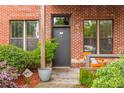 Home entrance featuring a cozy patio, seating area, and well-manicured greenery at 791 Wylie Se St # 709, Atlanta, GA 30316