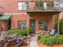 Inviting brick exterior with a cozy patio and lush, mature landscaping at 791 Wylie Se St # 709, Atlanta, GA 30316