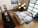 Bright living room featuring modern furnishings, art, and large windows at 1661 La France Ne St # 221, Atlanta, GA 30307