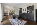Spacious office with hardwood floors, large windows, and built-in shelving at 320 Rossiter Rdg, Alpharetta, GA 30022
