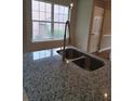 Kitchen island with stainless steel sink, faucet and granite countertops at 1356 Ambercrest Way, Austell, GA 30168