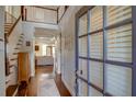 Bright foyer with hardwood floors, staircase, and views into the open-concept living spaces at 2604 Porchside Se Pl, Atlanta, GA 30316