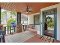Inviting covered front porch with swing, ceiling fan, and stylish welcome mat at 2604 Porchside Se Pl, Atlanta, GA 30316