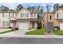 Inviting townhouse showcasing neutral siding, decorative shutters, and a manicured lawn at 4370 Stone Gate Way # 97, Atlanta, GA 30344