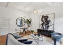 Stylishly furnished living room with hardwood floors, modern lighting, and access to the building at 1058 Piedmont Ave # 103, Atlanta, GA 30309