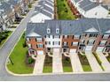 An aerial view of townhomes with manicured lawns, showcasing community layout at 3788 Chattahoochee Summit Se Dr # 22, Atlanta, GA 30339