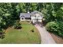 Scenic aerial view of a home nestled among lush trees, showcasing its private and serene setting at 83 Andrew Jackson Ct, Dallas, GA 30157
