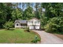 Inviting two-story home featuring a lovely front yard and a convenient two-car garage at 83 Andrew Jackson Ct, Dallas, GA 30157