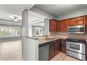Kitchen with granite countertops and stainless steel appliances overlooking the living area at 1502 River Green Nw Dr # 1502, Atlanta, GA 30327