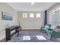 Inviting living room with natural light, hardwood floors, a piano, and comfortable seating arrangements at 319 Parkside Meadow Dr, Marietta, GA 30064