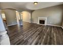 Spacious living room featuring modern floors, arched doorways and a fireplace with mantel at 4510 Swan Trce, Atlanta, GA 30349