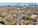 Sprawling aerial view of a residential neighborhood with a cityscape in the distance at 660 Delbridge Nw St, Atlanta, GA 30314