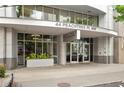 Exterior shot of 44 Peachtree with a covered entryway and attractive signage at 44 Peachtree Ne Pl # 1929, Atlanta, GA 30309