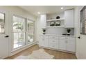 Dining area featuring built-in cabinets and large windows at 605 Patrick Ne Pl, Sandy Springs, GA 30328