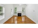 Bright living room features fireplace, hardwood floors, and multiple windows at 655 Mead Se St # 58, Atlanta, GA 30312