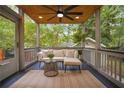 Inviting covered back porch with comfortable seating and ceiling fan at 615 Sycamore Dr, Decatur, GA 30030