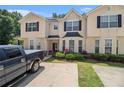 Charming townhome with beautiful curb appeal, manicured lawn, and inviting entrance, close to the neighborhood at 7324 Bridlewood Ct, Jonesboro, GA 30236