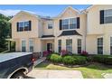 Charming townhome with curb appeal, featuring lovely landscaping, a well-manicured lawn and ample parking at 7324 Bridlewood Ct, Jonesboro, GA 30236