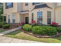 Inviting townhome with well-manicured lawn and garden, enhancing its curb appeal at 7324 Bridlewood Ct, Jonesboro, GA 30236